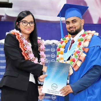 Graduate in Bachelor of Engineering (Honours) Civil (Pass) Visham Prasad receives his graduation certificate from Regional CEO - Digicel, Shally Jannif.