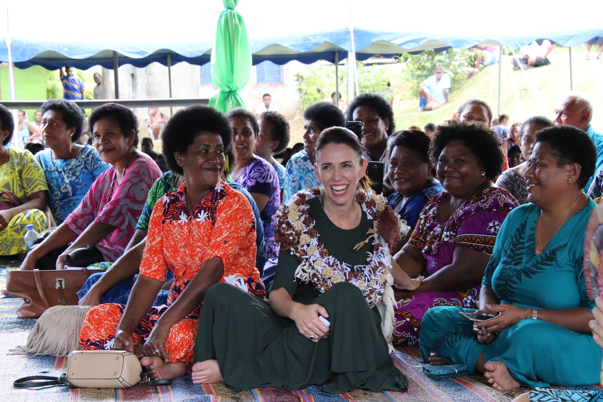NZ PM Honorable Jacinda Arden with the villagers of Tamavua-I-wai.