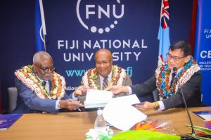 (from left) FNU’s Acting Vice-Chancellor, Professor Nii-K Plange, Deputy Prime Minister and Minister for Trade, Co-operatives, Small and Medium Enterprises, Honourable Manoa Kamikamica, TOPPAN Ecquaria Pte Limited Managing Director, Chong Ser Wah sign the MoU. 