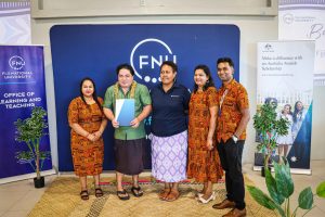 Tofia Afioga receives his programme competition notice during the completion ceremony.