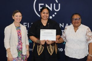 Florence recieves her completion letter at the FNU Nasinu Campus. 