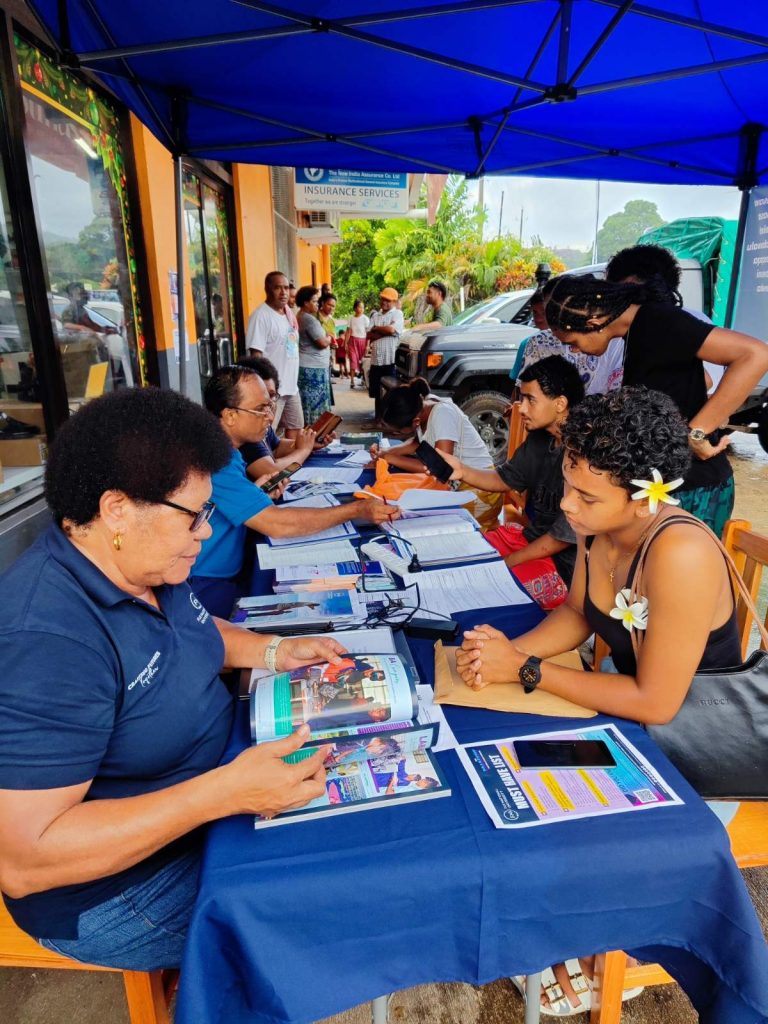 People waiting in long lines to be served at the FNU Roadshow booth at Somosomo